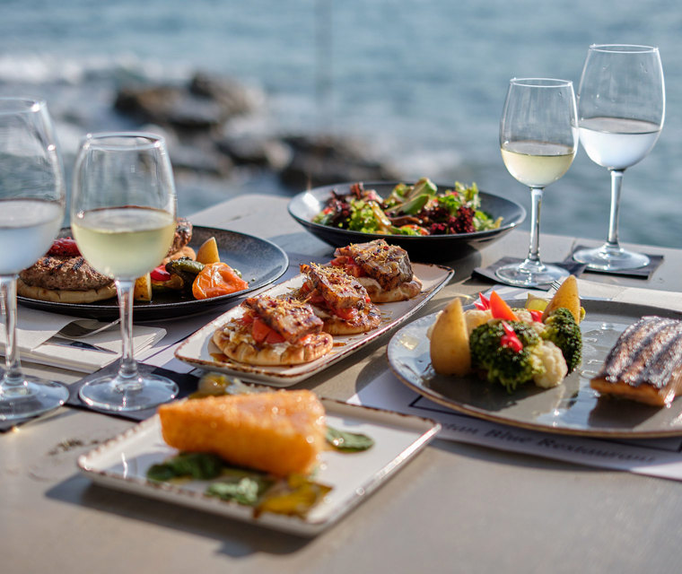 Cretan Blue Beach Hotel lunch by the sea with gourmet food and white wine
